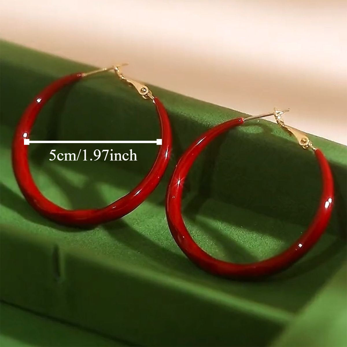 A pair of stylish and simple full C hoop earrings